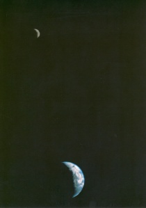 The first picture of the Moon and Earth together in space, taken by Voyager 1.